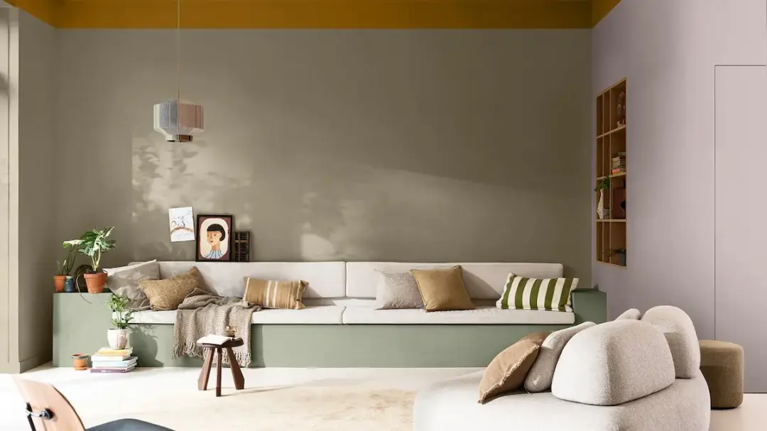 Dulux 2027 Lift living room with an ochre ceiling and sage green accents