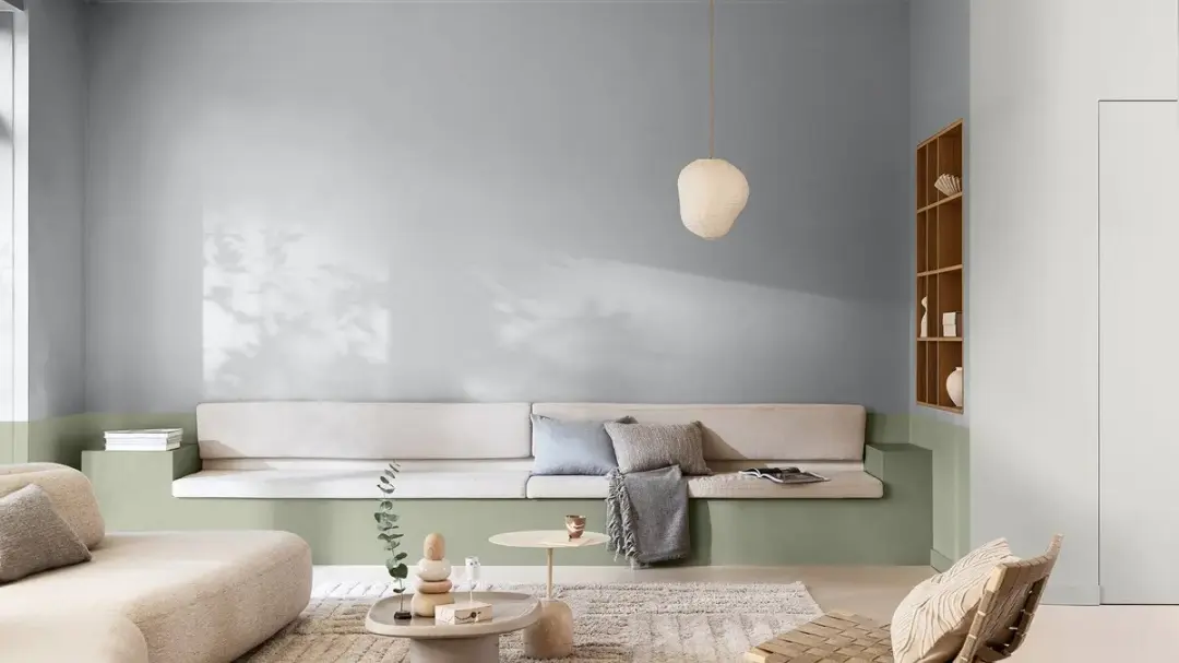 Dulux 2027 Light living room with gentle neutral walls and sage green accents